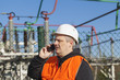 Photo: Electrical engineer talking on the phone Electrical engineer talking on the phone