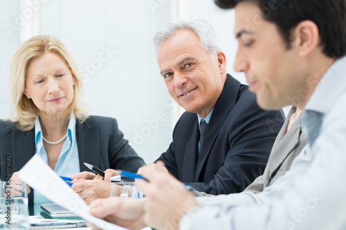 Photo: Business People In Meeting Business People In Meeting