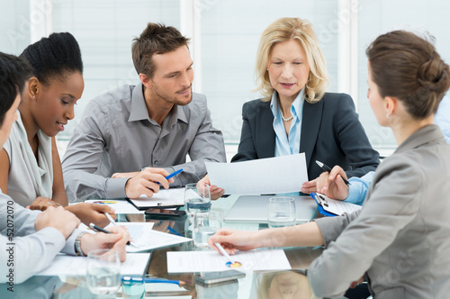 Photo: Business People In Meeting Business People In Meeting