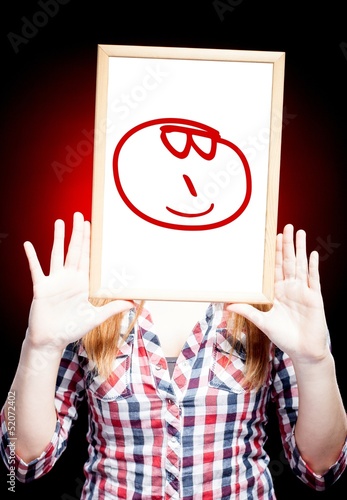 Photo: Woman showing glasses emoticon in front of face Woman showing glasses emoticon in front of face
