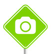 Illustration: Green pemissive traffic sign with camera icon Green pemissive traffic sign with camera icon