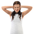 Young woman trying to block out a noise with her hands