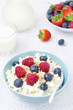 Photo: bowl of cottage cheese with berries, honey and nuts vertical bowl of cottage cheese with berries, honey and nuts vertical