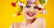 Photo: Woman with hairstyle and flower. Isolated on yellow Woman with hairstyle and flower. Isolated on yellow