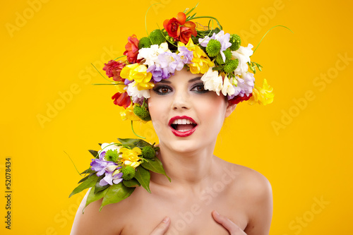 Photo: The attractive girl, front portrait, on a head a flower wreath The attractive girl, front portrait, on a head a flower wreath