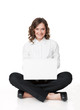Photo: Portrait of a pretty young woman sitting in front of her laptop Portrait of a pretty young woman sitting in front of her laptop