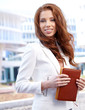 A portrait of a young business woman in an office