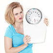 Foto: Woman is in a rage because of keeping to a diet Woman is in a rage because of keeping to a diet