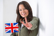 Photo: Portrait of a lovely young woman with United Kingdom's flag smil Portrait of a lovely young woman with United Kingdom's flag smil