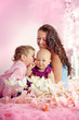 Photo: Portrait of a happy mother and her children boy and girl sitting Portrait of a happy mother and her children boy and girl sitting