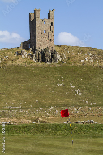 Photo: Dunstanburgh Castle Tower above golf course Dunstanburgh Castle Tower above golf course