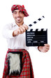 Scotsman with movie board on white