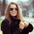 Photo: Young woman in glasses smiles fun Young woman in glasses smiles fun