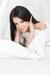 A young girl in the morning bliss on her bed