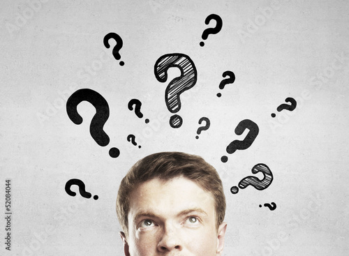 Photo: man with questions symbol man with questions symbol
