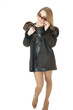 Elegant woman in sunglasses wearing brown sheepskin coat