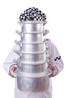 Cook with stack of pots on white