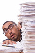 Busy businessman with lots of papers