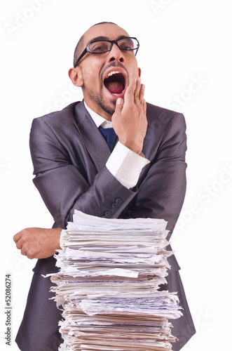 Photo: Busy businessman with lots of papers Busy businessman with lots of papers