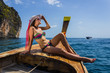 The girl in a bathing suit on a boat
