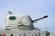 Metal canon on deck of a museum battleship