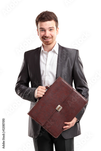 Photo: Business man with briefcase standing on white background Business man with briefcase standing on white background