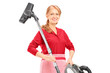 Photo: A middle aged female holding a vacuum cleaner A middle aged female holding a vacuum cleaner
