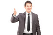 A young businessman giving thumb up