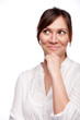 Thinking woman smiling looking up