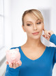 Photo: lovely woman with piggy bank lovely woman with piggy bank