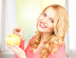 Photo: woman with piggy bank and cash money woman with piggy bank and cash money