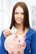 lovely woman with piggy bank and money