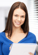 happy woman with big notepad