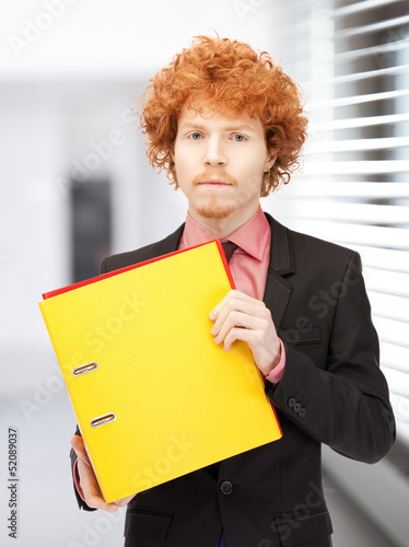 Photo: man with folders man with folders