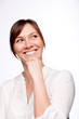 Thinking woman smiling looking up