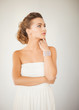 woman with pearl earrings and bracelet