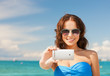woman in bikini with phone
