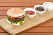 Buger with ketchup, caramelised onions and coleslaw.