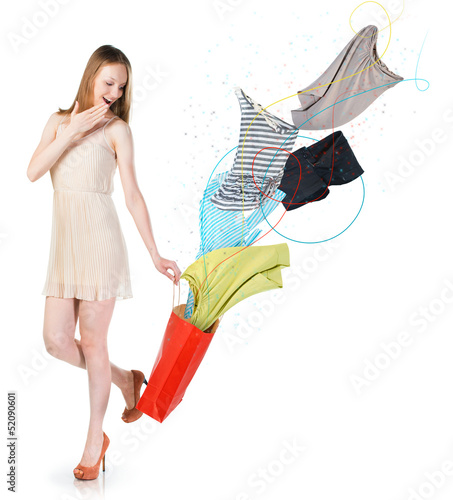 Photo: Woman with clothes flying into the bag Woman with clothes flying into the bag