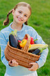 Photo: Vegetable garden - lovely girl with basket of vegetables Vegetable garden - lovely girl with basket of vegetables