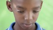 Video: Portrait of sad young black boy looking at camera Portrait of sad young black boy looking at camera