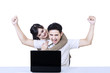 Photo: Boyfriend shouting looking at laptop - isolated Boyfriend shouting looking at laptop - isolated