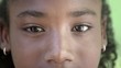 Vidéo : Portrait of happy young black girl looking at camera, smiling Portrait of happy young black girl looking at camera, smiling