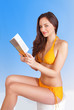 Leisure reading girl on beach holiday