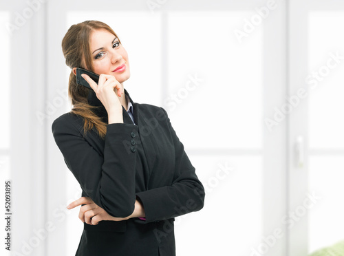 Photo: Businesswoman talking on the phone Businesswoman talking on the phone