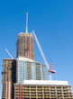 Photo: Condo tower with cranes Condo tower with cranes