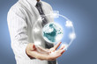 Photo: earth globe in his hands earth globe in his hands