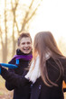 Foto: caucasian couple playing with scarf outside caucasian couple playing with scarf outside