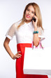 woman with shopping bags talking on mobile