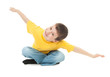 boy in yellow t-shirt simulates flight